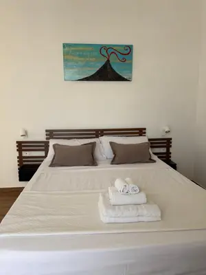 Letto o letti in una camera di Storico 31 Stanze ai Quartieri Spagnoli
