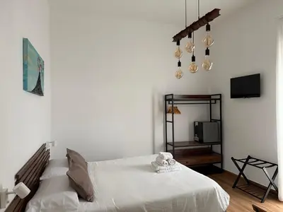 Letto o letti in una camera di Storico 31 Stanze ai Quartieri Spagnoli