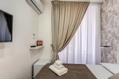 Letto o letti in una camera di Casa Dora
