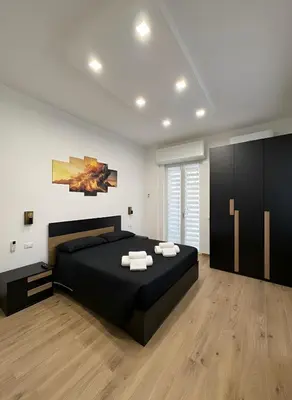 Letto o letti in una camera di CIAO PARTENOPE - luxury rooms