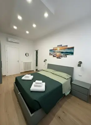 Letto o letti in una camera di CIAO PARTENOPE - luxury rooms