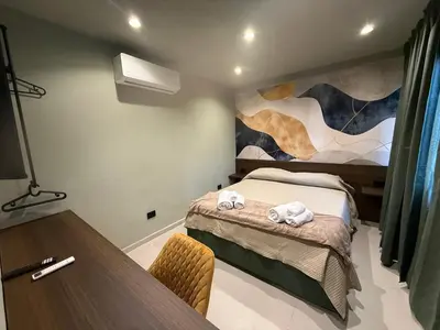 Letto o letti in una camera di Stay & Dream in Naples