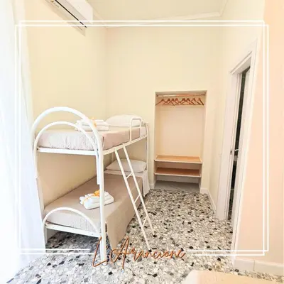 Letto o letti in una camera di EMME Napoli II