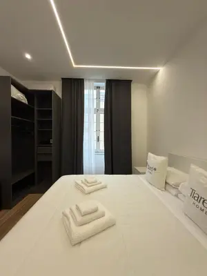 Letto o letti in una camera di Tiaré Home Napoli