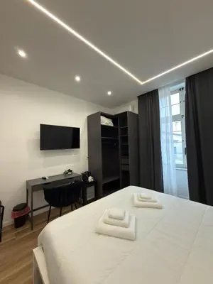 Letto o letti in una camera di Tiaré Home Napoli