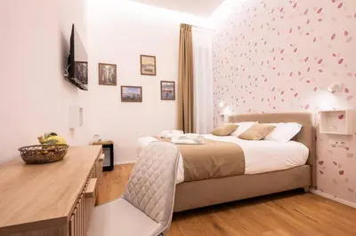 Letto o letti in una camera di L'Eco del Centro Charme nel cuore di Napoli