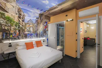 Letto o letti in una camera di Calumé - I Vicoli di Napoli - Comfort & Relax for Couples and Families