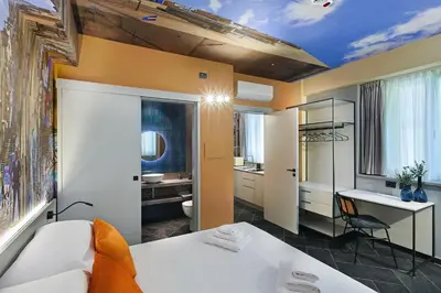 Letto o letti in una camera di Calumé - I Vicoli di Napoli - Comfort & Relax for Couples and Families