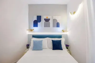 Letto o letti in una camera di Mama Apartment
