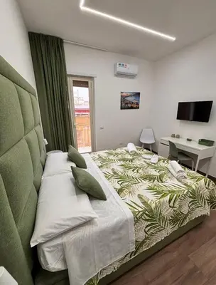 Letto o letti in una camera di Il Faro di Santa Lucia