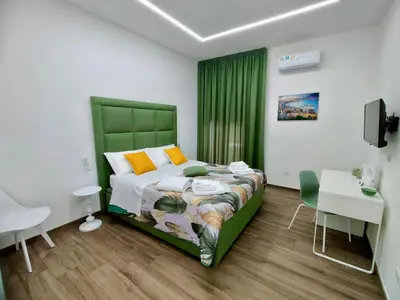 Letto o letti in una camera di Il Faro di Santa Lucia