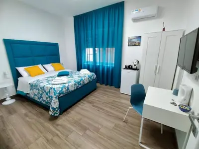 Letto o letti in una camera di Il Faro di Santa Lucia
