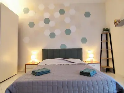 Letto o letti in una camera di Albi House Vomero