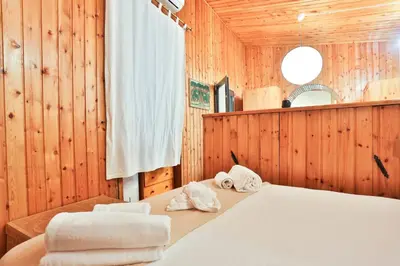 Letto o letti in una camera di GuestHost - La Casetta Bohemien