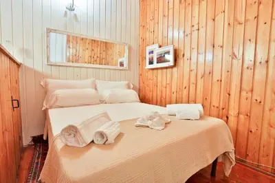 Letto o letti in una camera di GuestHost - La Casetta Bohemien