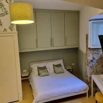 Letto o letti in una camera di Casa Dadè