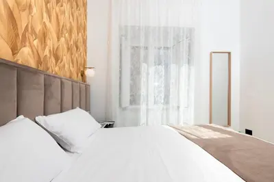 Letto o letti in una camera di Hotel Odeon Napoli