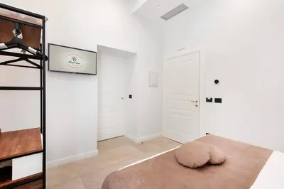 Letto o letti in una camera di Hotel Odeon Napoli