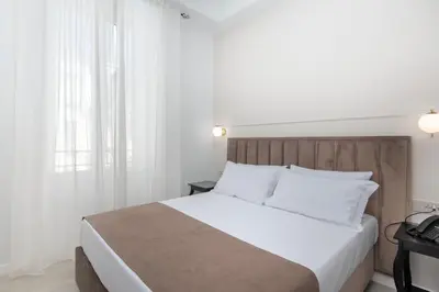Letto o letti in una camera di Hotel Odeon Napoli