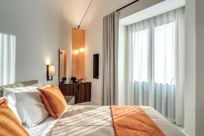 Letto o letti in una camera di Residenze Piazza Dante