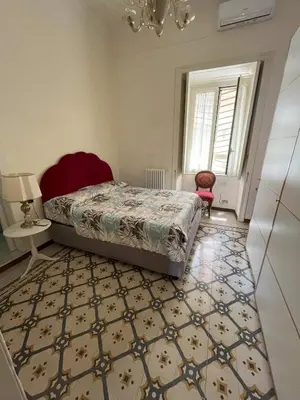 Letto o letti in una camera di Historic Vomero Apartment with Secluded Patio