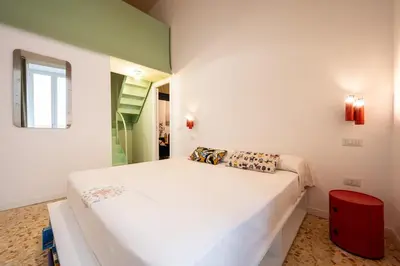 Letto o letti in una camera di Maison Noir Napoli