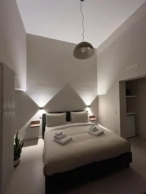 Letto o letti in una camera di B&B Palazzo Domini