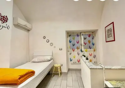 Letto o letti in una camera di Napoli Magica