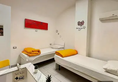 Letto o letti in una camera di Napoli Magica