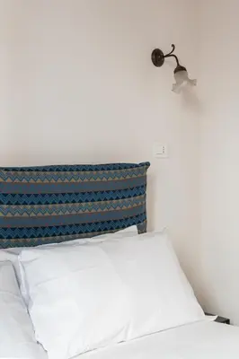 Letto o letti in una camera di I tre Santi by Dimorra