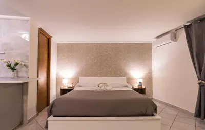 Letto o letti in una camera di Chiaia Partenopeo
