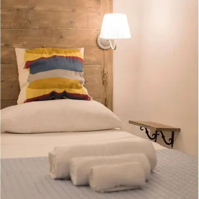 Letto o letti in una camera di L Aurora di Napoli