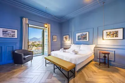 Letto o letti in una camera di Elite Art Palace by Napoliapartments