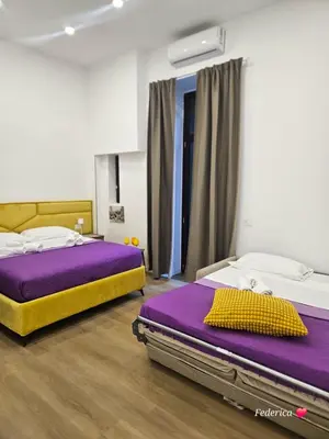 Letto o letti in una camera di Le 2 sorelle Luxury Rooms