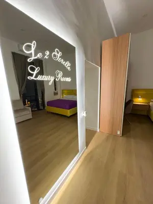 Letto o letti in una camera di Le 2 sorelle Luxury Rooms