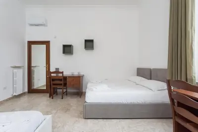 Letto o letti in una camera di VomeroMetroNest By Dimorra