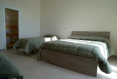 Letto o letti in una camera di Bed and Breakfast Gianluca