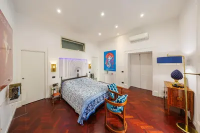 Letto o letti in una camera di Bellini Inn Primo Piano
