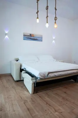Letto o letti in una camera di San Gennà Urban Suite Napoli