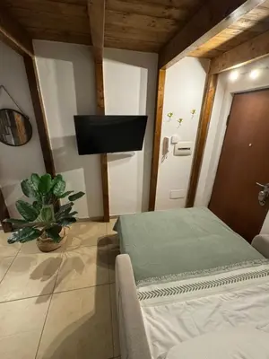 Letto o letti in una camera di Maison Brigitte Napoli