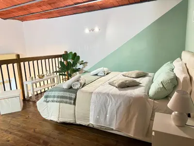 Letto o letti in una camera di Maison Brigitte Napoli