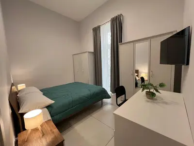 Letto o letti in una camera di Garibaldi Apartment