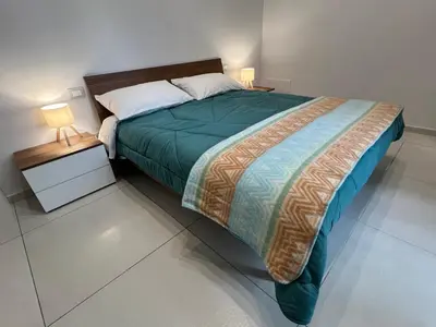 Letto o letti in una camera di Garibaldi Apartment