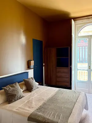 Letto o letti in una camera di La Nona Casa - Guest house nel cuore di Napoli