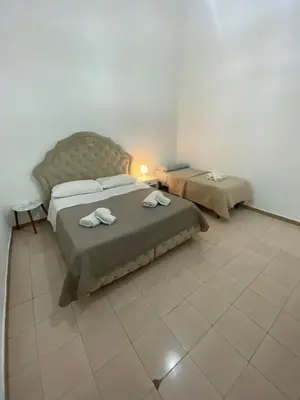 Letto o letti in una camera di Eva Rooms Stazione Garibaldi