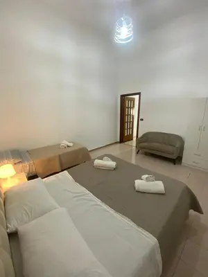 Letto o letti in una camera di Eva Rooms Stazione Garibaldi