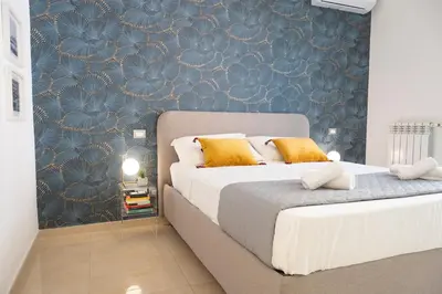 Letto o letti in una camera di Feel Napoli nuovo, comodo, centrale e a 2 min dalla Metro!