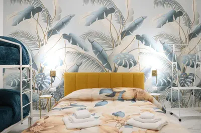 Letto o letti in una camera di La Maison di Mery Naples Center