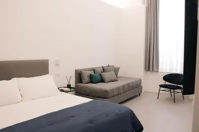 Letto o letti in una camera di Six Luxury Rooms Quartieri Spagnoli