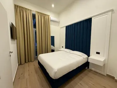Letto o letti in una camera di Chiaia Lifestyle Suite